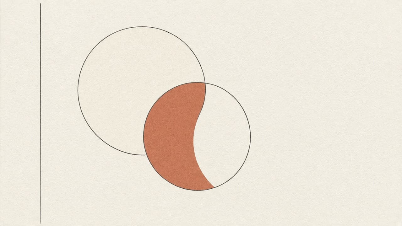 Two overlapping circles, charcoal outline and terracotta fill
