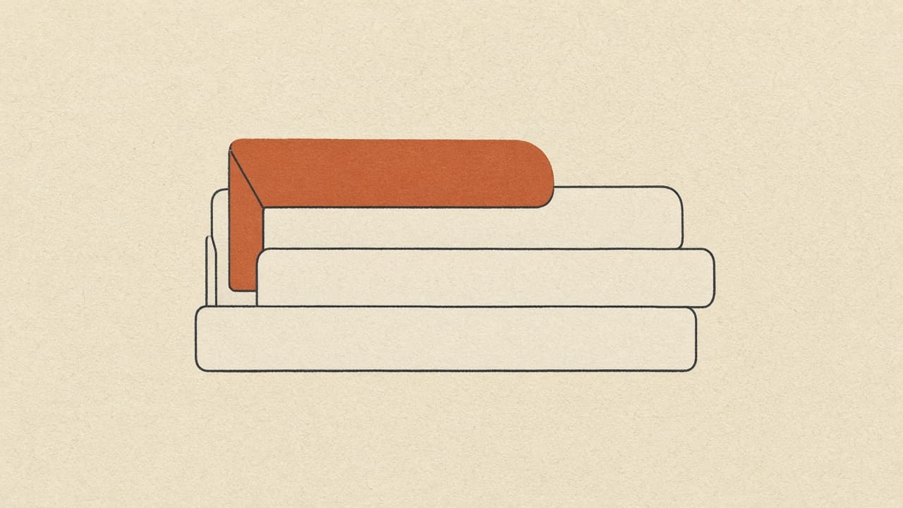 Stacked geometric folders with a terracotta tab on warm paper